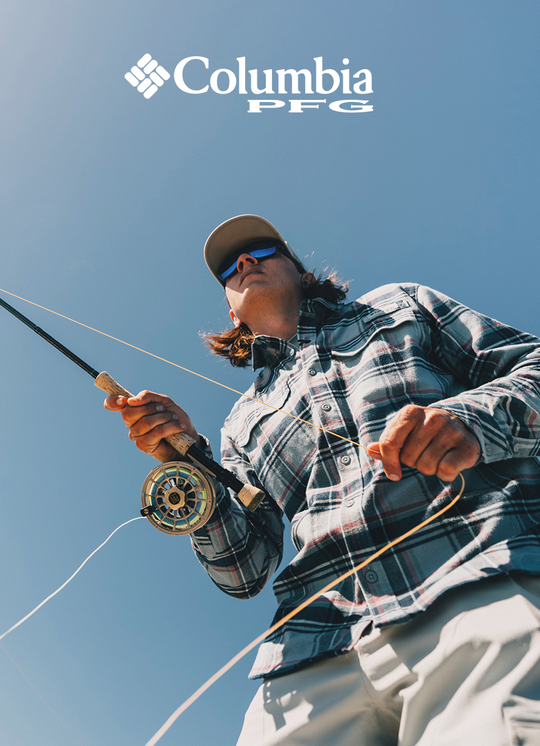 Columbia PFG. A close up of a man holding his line tight while angling. 