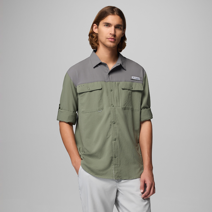 A man wearing a green long sleeve button-up shirt.