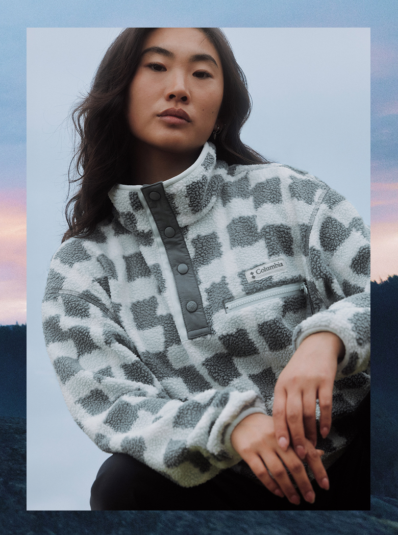 Woman in a checkered grey and white fleece