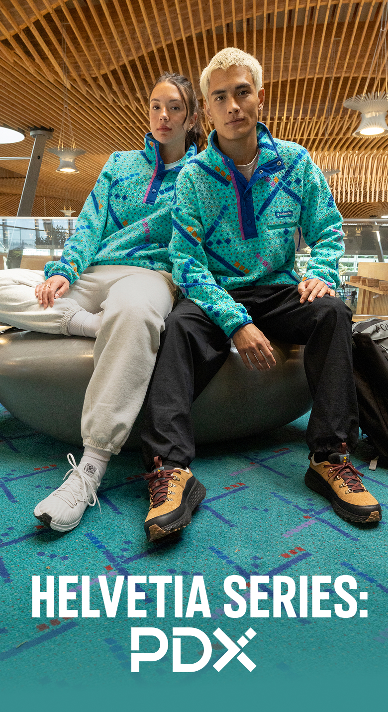Helvetia Series: PDX. Two people at the Portland airport wearing the Helvetia fleece with the legendary carpet pattern.