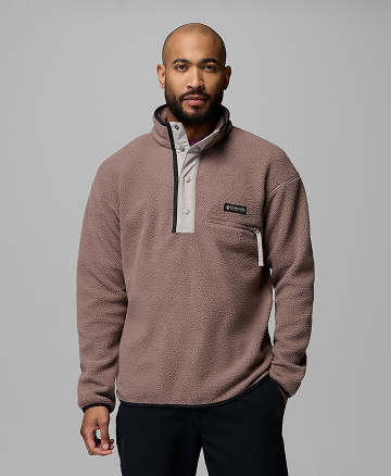 A man wearing a mauve fleece pullover.