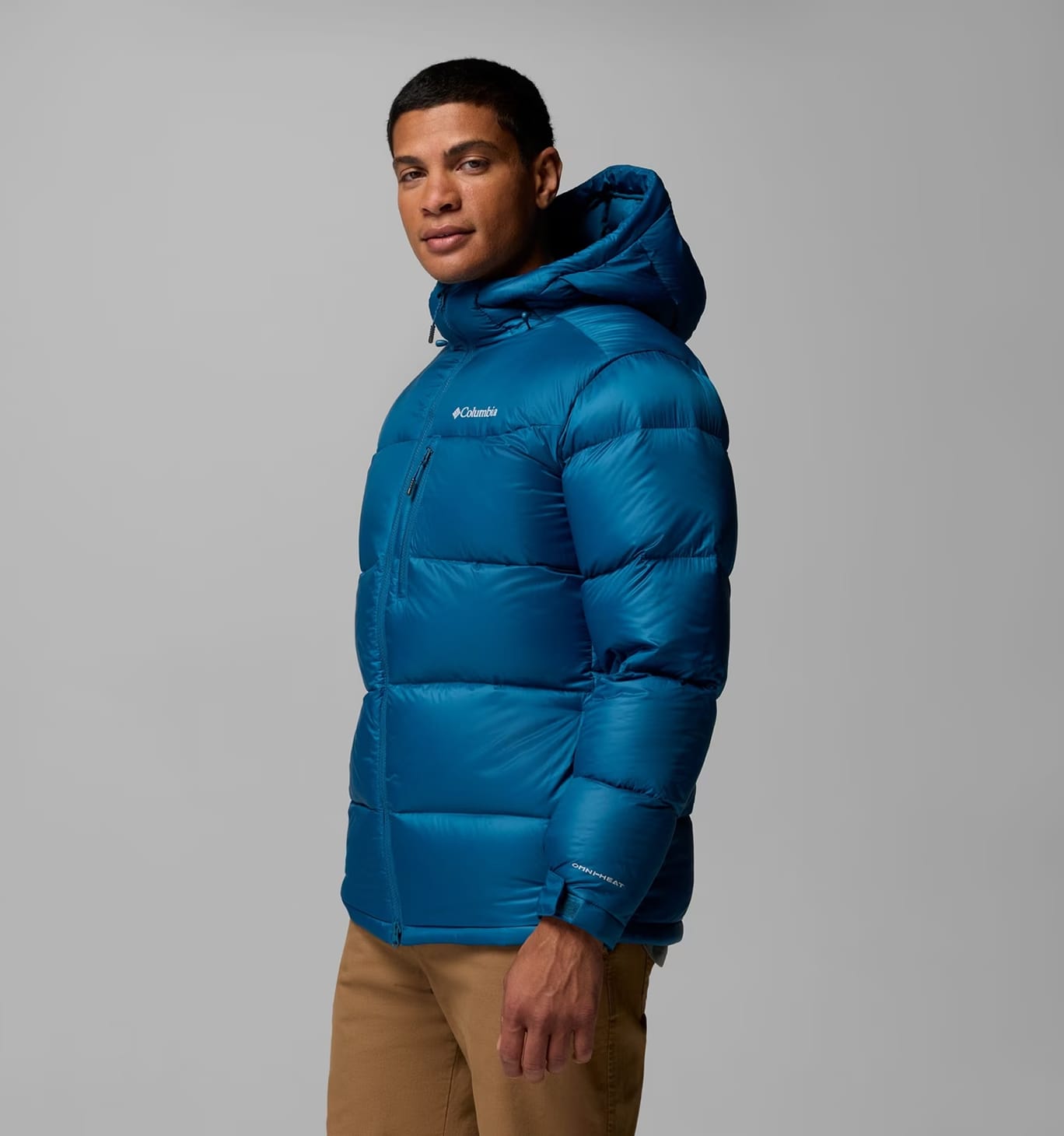 A man wearing a blue puffer jacket.