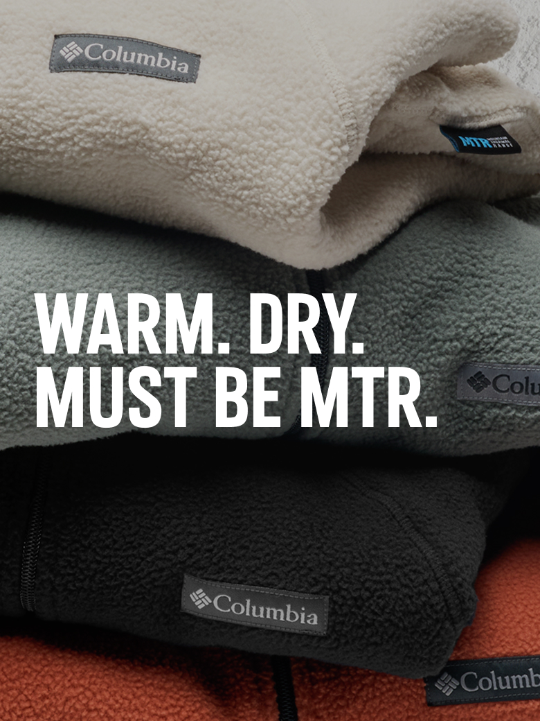 A stack of colorful fleece with text: WARM. DRY. MUST BE MTR.