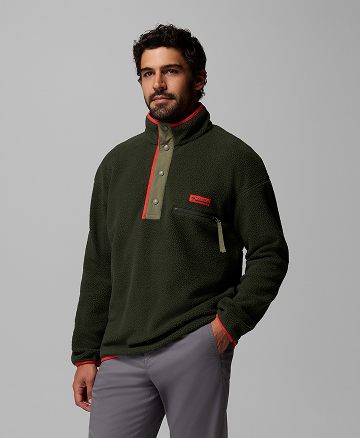 A man wearing a dark green fleece pullover.