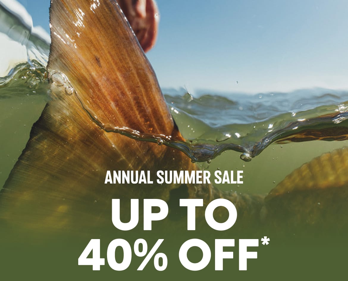 Close-up of a fish tale in the water with text: ANNUAL SUMMER SALE UP TO 40% OFF*