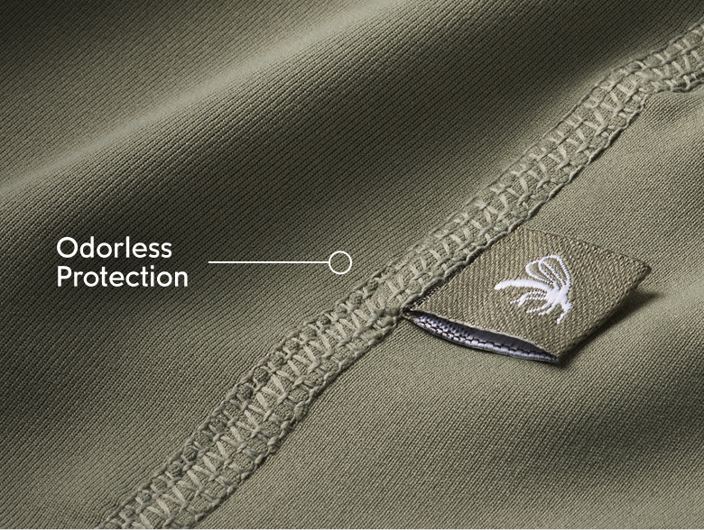 Close-up of green fabric with text: Odorless Protection
