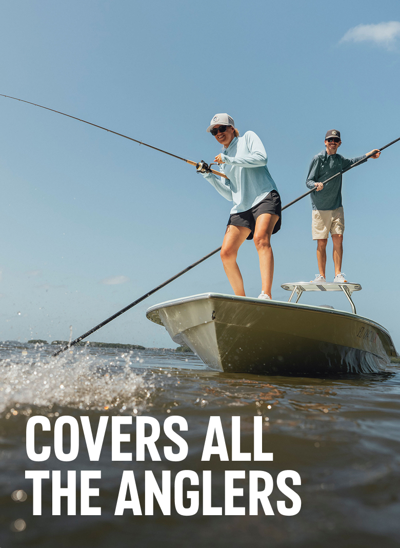 Covers all the anglers. A woman reels in her line while standing on a boat, while a man behind her waits with the net. 
